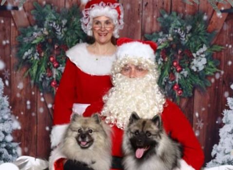 Santa and Mrs. Clause with dogs