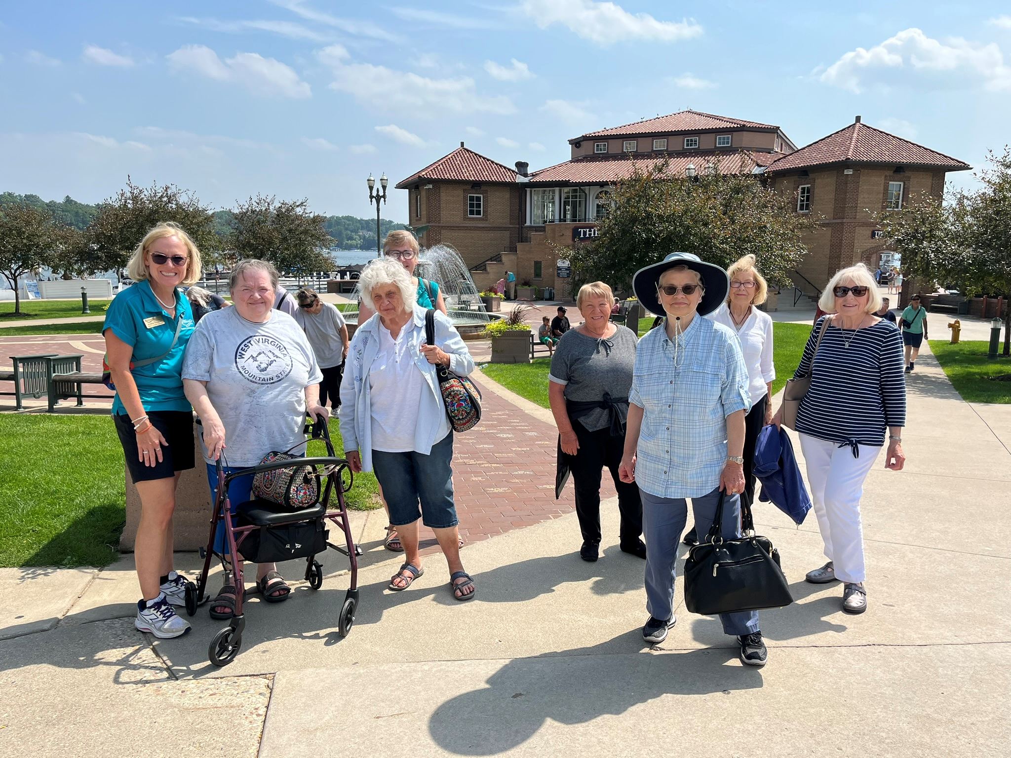 Day trip group in front of the harbor and boat dock at Lake Geneva Wisconsin
